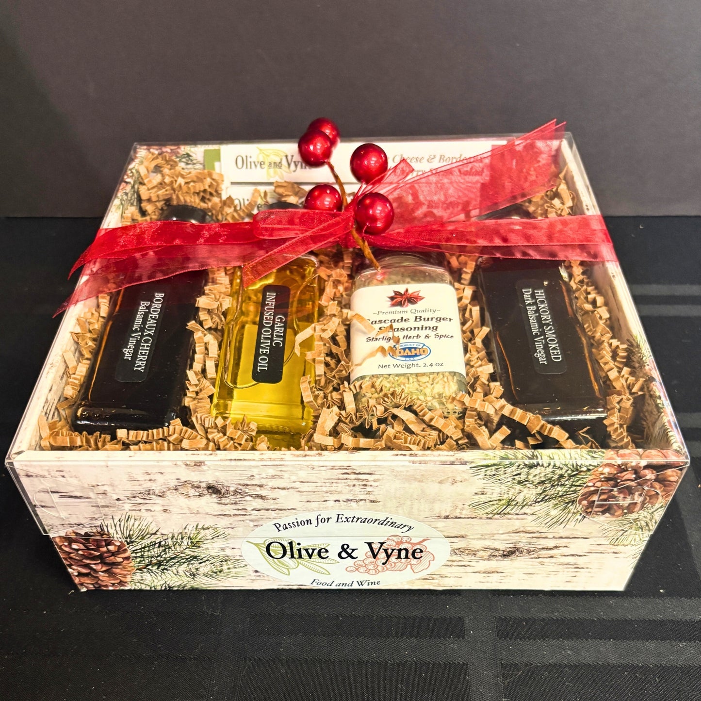 Gourmet BBQ gift set with cherry and hickory balsamic vinegars, infused olive oil, and burger seasoning in holiday box