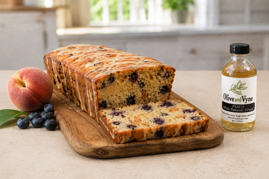 Peach blueberry yogurt loaf with Peach Balsamic glaze, fresh fruit, and Olive & Vyne Peach White Balsamic.