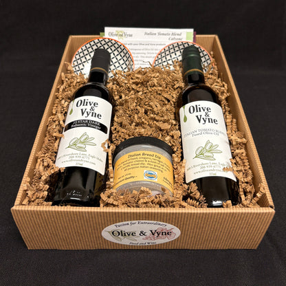 Open bread dipping gift set with 25 Star Dark Balsamic, Italian Tomato Fused Olive Oil, bread dip seasoning, two ceramic dishes, and recipe cards.