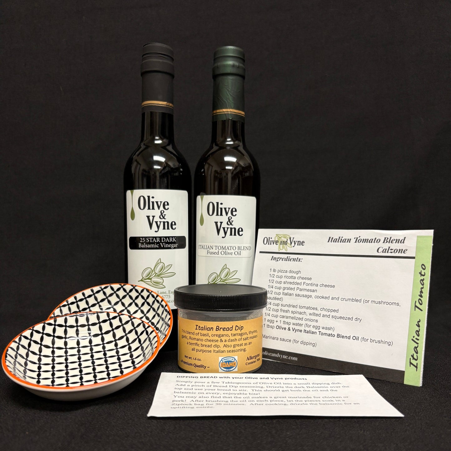 25 Star Dark Balsamic, Italian Tomato Fused Olive Oil, two ceramic dipping dishes, bread dip seasoning, and recipe cards.
