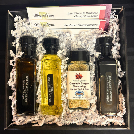 Burger Lovers Gift Box contents—Bordeaux Cherry Dark Balsamic, Garlic Infused Olive Oil, Cascade Burger Seasoning, Hickory Smoked Dark Balsamic with recipe cards