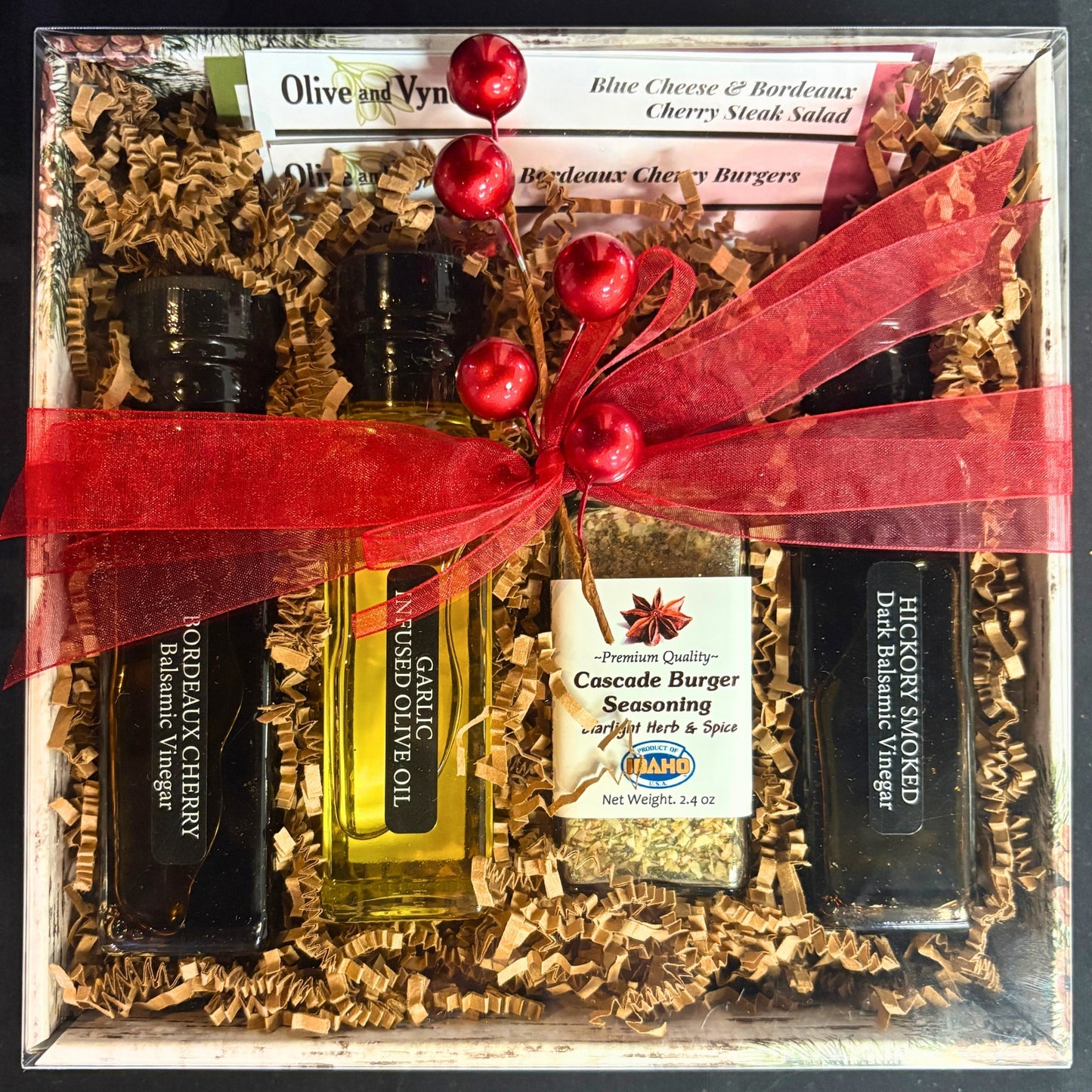 Burger Lovers Gift Box with Bordeaux Cherry balsamic, Garlic infused olive oil, Cascade Burger Seasoning, and Hickory Smoked balsamic tied with red ribbon