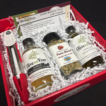 Garlic Balsamic & Oregano Pasta Lovers gift box with olive oil, balsamic, pasta seasoning, mini tongs, and recipe card.