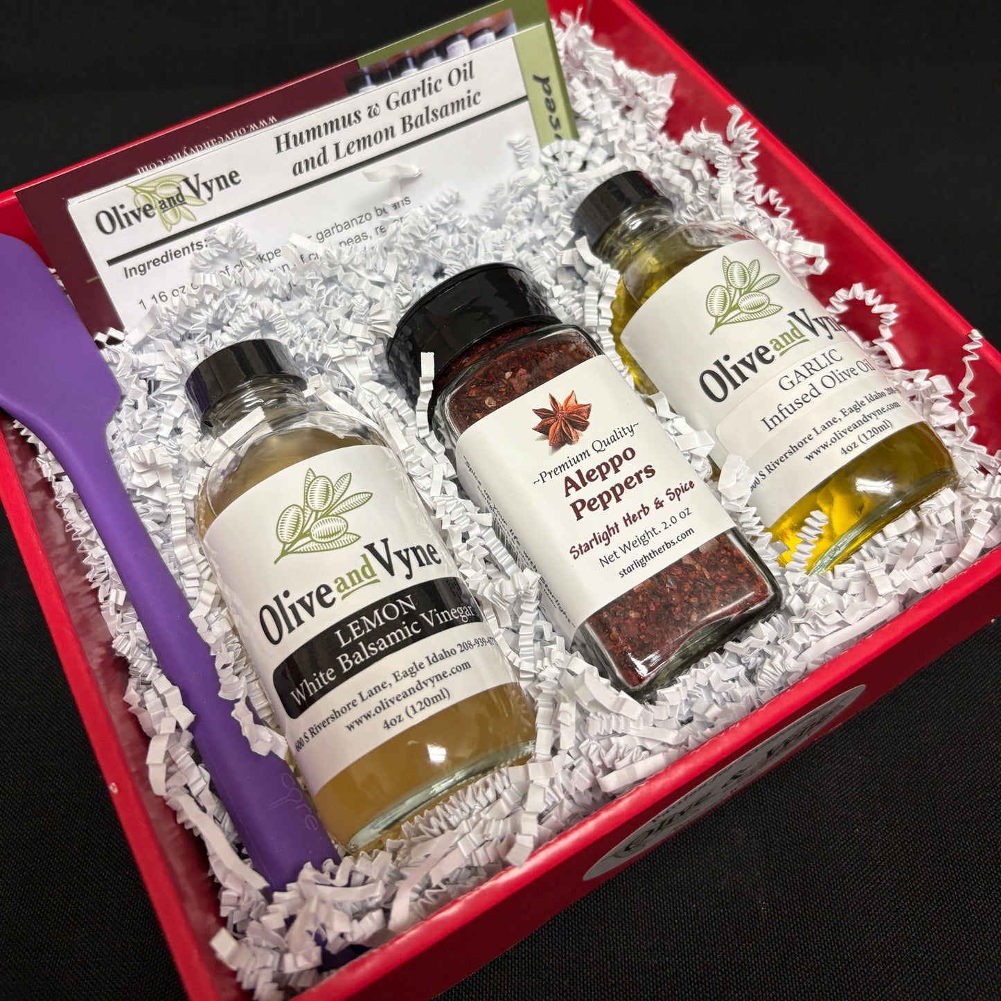 Hummus recipe gift box with Garlic Infused Olive Oil, Lemon White Balsamic, Aleppo Pepper, and mini silicone spatula.
