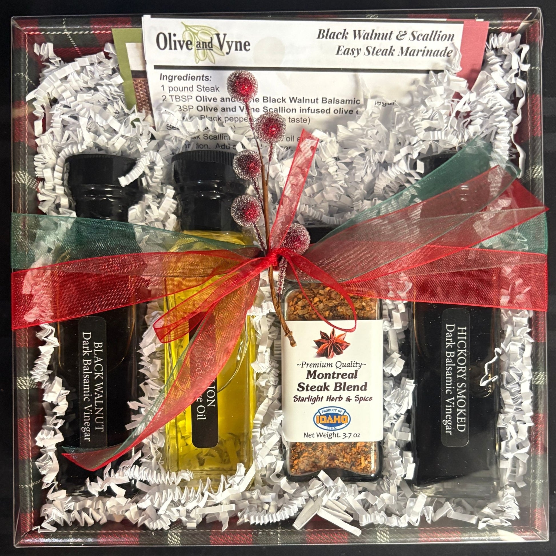 Steak Lovers Gift Box with Black Walnut Balsamic, Scallion Infused Olive Oil, Montreal Steak Blend, and Hickory Smoked Balsamic tied with ribbon